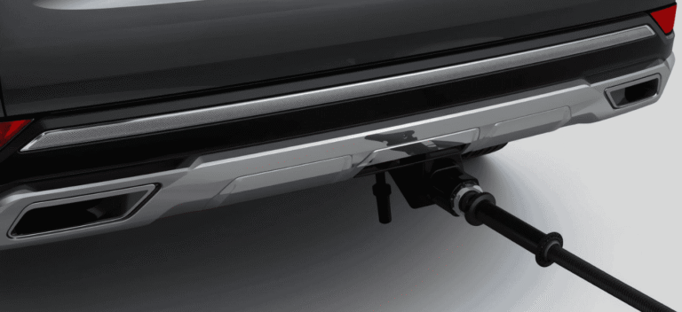 Rear view of a car with a tow bar and a connected black tow hitch